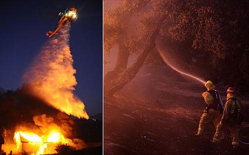 Com helicóptero despejando água e com pessoal no chão com mangueiras, bombeiros combatem as chamas de um incêndio florestal em Banning, na Califórnia
