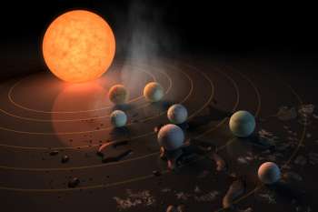 The TRAPPIST-1 star, an ultra-cool dwarf, has seven Earth-size planets orbiting it. This artist's concept appeared on the cover of the journal Nature in Feb. 2017 announcing new results about the system.